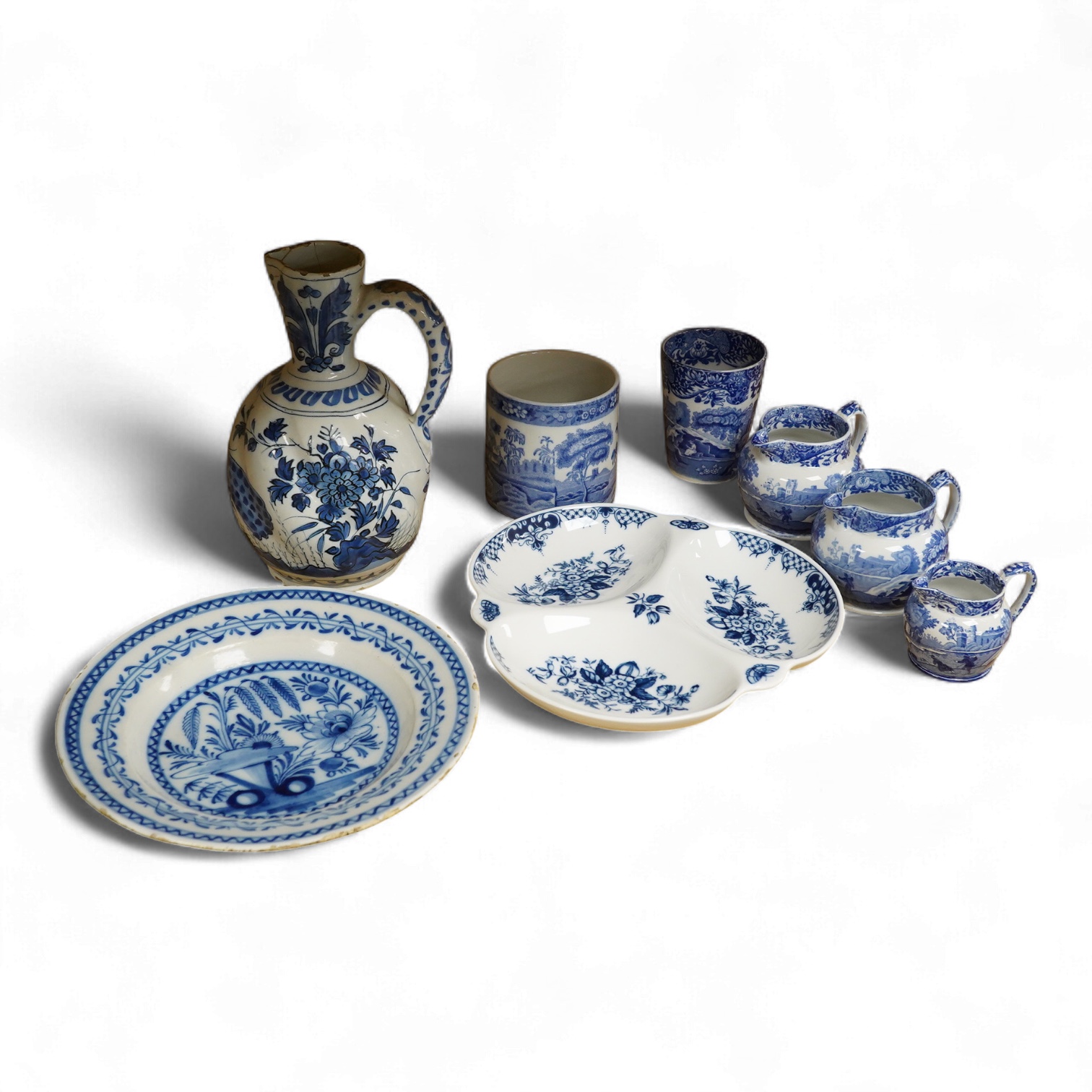 An 18th century Delft jug, another tin glazed dish, a Worcester Hanbury dish and five pieces of Copeland Spode Italian blue and white, tallest 22.5cm